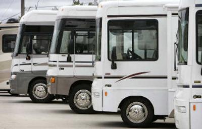 
Winnebago motor homes are shown on a lot in Jefferson, Iowa. Winnebago Industries Inc. on Thursday said fiscal fourth-quarter earnings fell sharply. 
 (Associated Press / The Spokesman-Review)