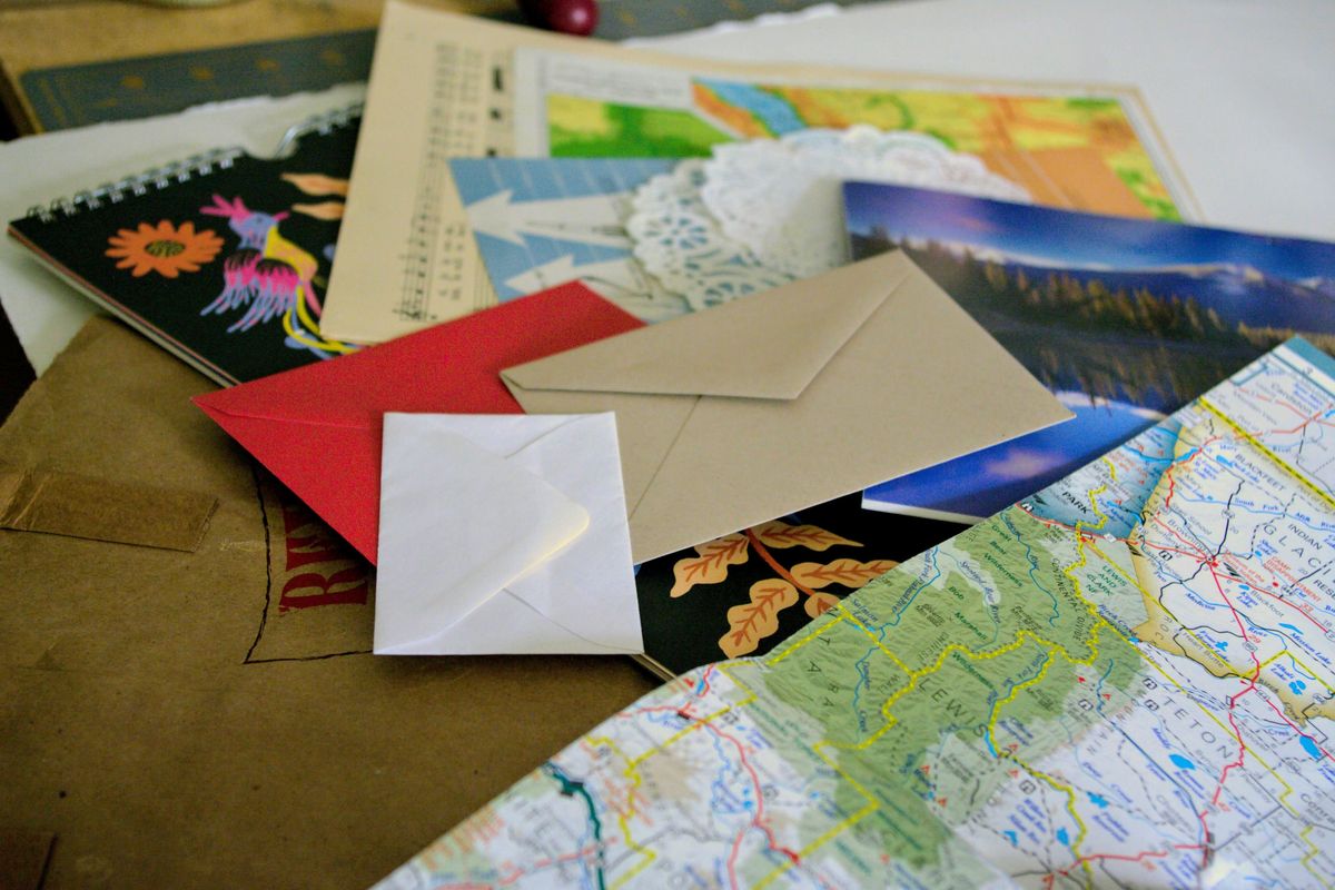 Reuse those paper goods like last year’s calendar, brown paper bags, old maps and retired books to give character and a handmade touch to do-it-yourself envelopes. (Katie Patterson Larson/For The Spokesman-Review)