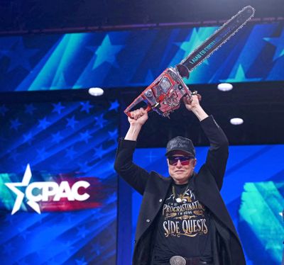 Elon Musk holds a chainsaw reading “Long live freedom, damn it” during the annual Conservative Political Action Conference (CPAC) at the Gaylord National Resort & Convention Center at National Harbor in Oxon Hill, Maryland, on Feb. 20, 2025. The chainsaw was a present to Elon Musk from Argentina’s President Javier Milei. (Saul Loeb/AFP/Getty Images/TNS) (Saul Loeb/Getty Images North America/TNS)