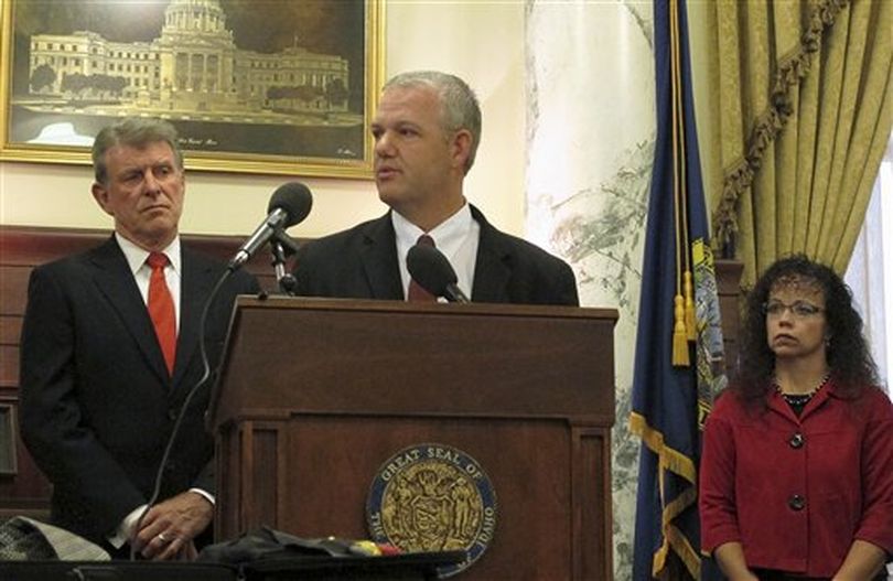 New State Controller Brandon Woolf, center, flanked on the left by Gov. C.L. 