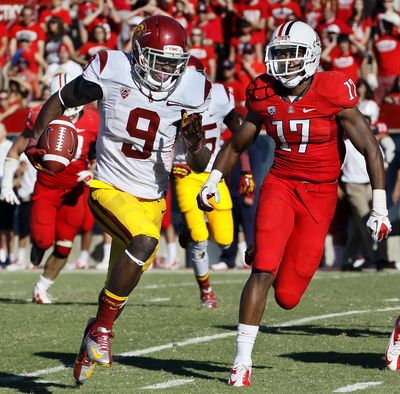 USC’s Marqise Lee races for a score as Derrick Rainey pursues. Lee finished with a Pac-12 record of 345 yards. (Associated Press)