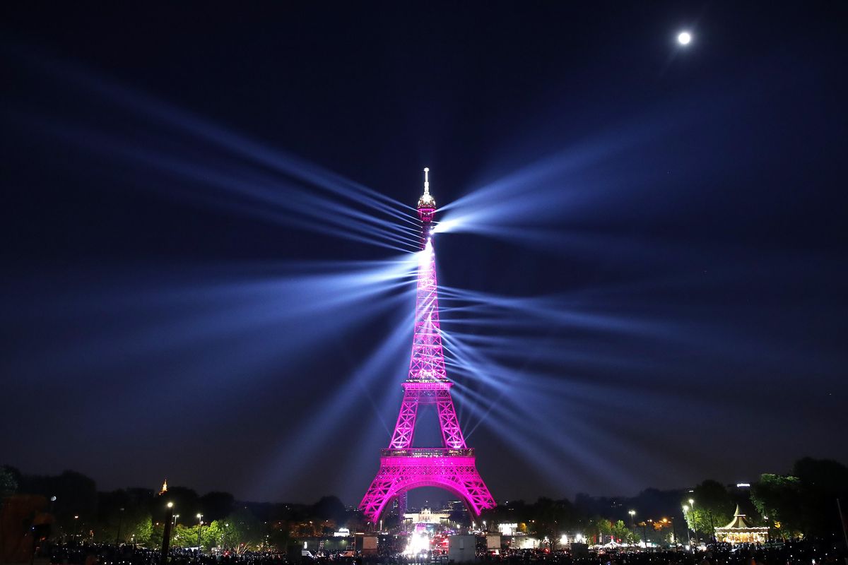 A light show illuminates the Eiffel Tower for its 130 year anniversary, in Paris, Wednesday, May 15, 2019. Paris is wishing the Eiffel Tower a happy birthday with an elaborate laser show retracing the monument