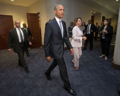 President Barack Obama and House Minority Leader Nancy Pelosi of California leave a meeting Friday with House Democrats on Capitol Hill. (Associated Press)