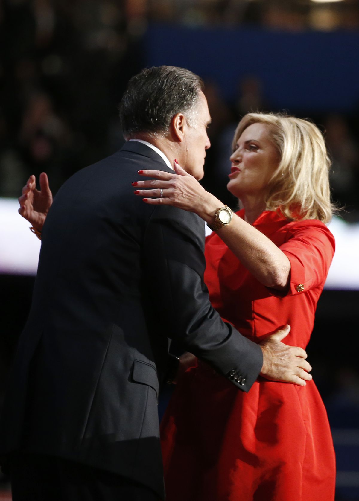 Republican presidential nominee Mitt Romney hugs his wife Ann Romney on stage at the Republican National Convention in Tampa, Fla. on Tuesday, Aug. 28, 2012. (Jae Hong / Associated Press)
