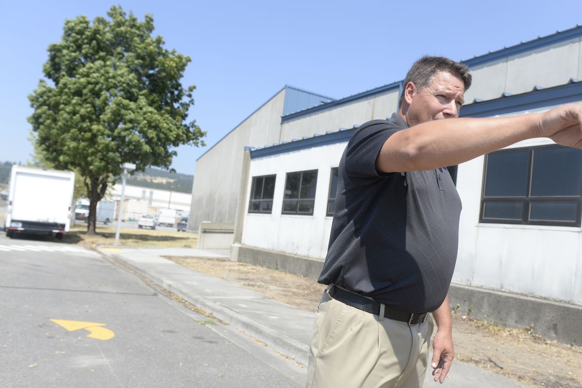 East Valley Interim Superintendent Tom Gresch stands outside the former Walker Army Reserve Center at Spokane Industrial Park and explains why it works so well for his district, on Wednesday. (Jesse Tinsley)