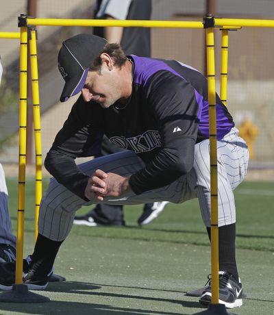 Colorado Rockies' Jamie Moyer stretches before a spring training baseball workout last month. The 49-year-old pitcher didn’t play last season after elbow surgery. (Associated Press)