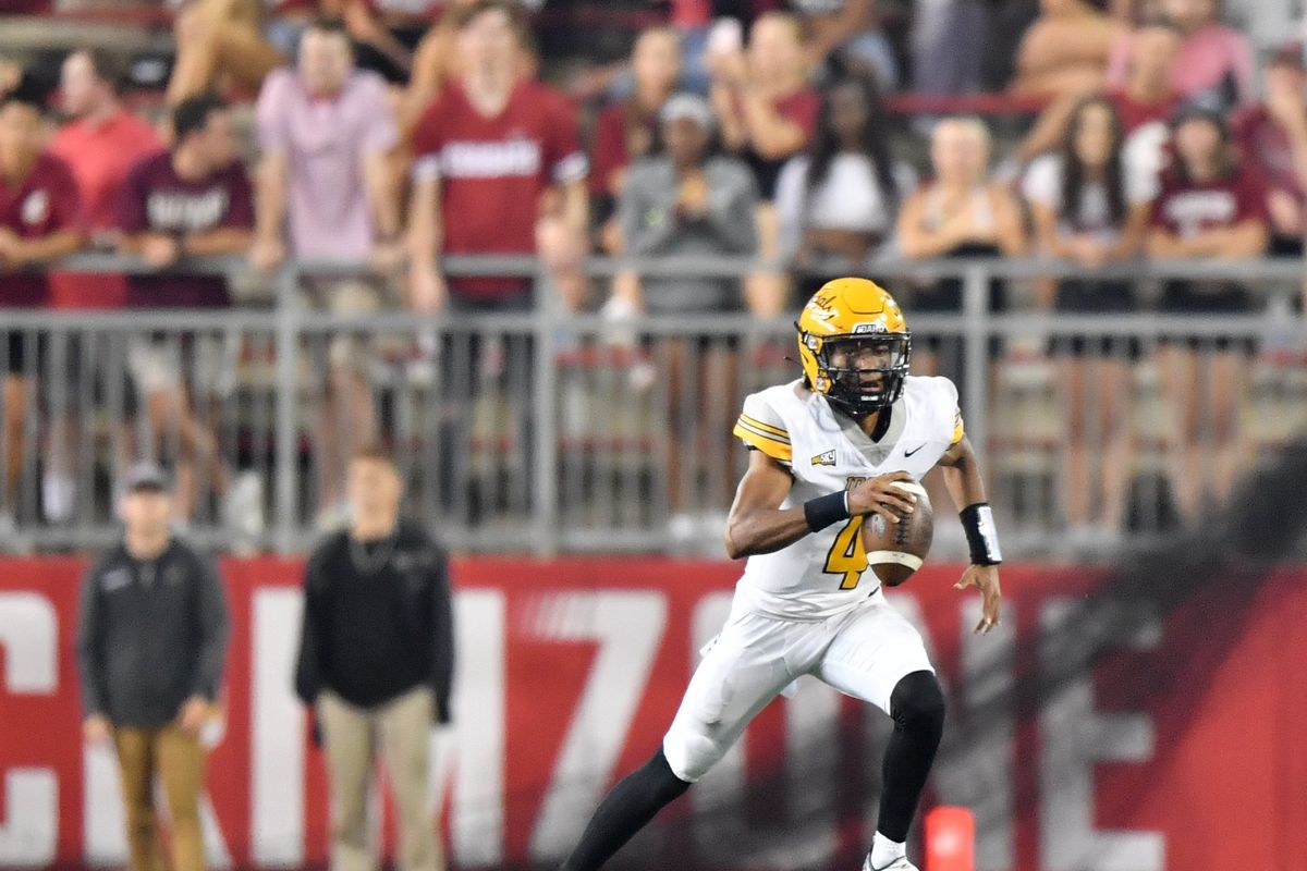 Idaho quarterback Gevani McCoy runs against Washington State during the first half of a nonconference game on Sept. 3 at Gesa Field in Pullman.  (Tyler Tjomsland/The Spokesman-Review)