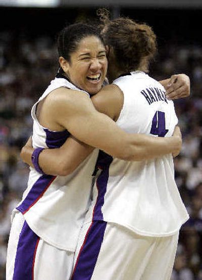 
Monarchs guard Kara Lawson, left, celebrates with a teammate. 
 (Associated Press / The Spokesman-Review)