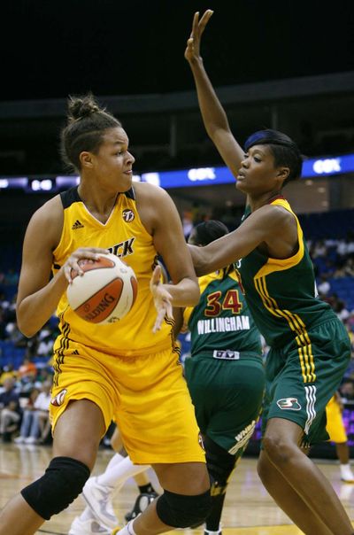 Seattle’s Ashley Robinson, right, defends against Tulsa’s Liz Cambage during Tuesday night’s WNBA game. (Associated Press)
