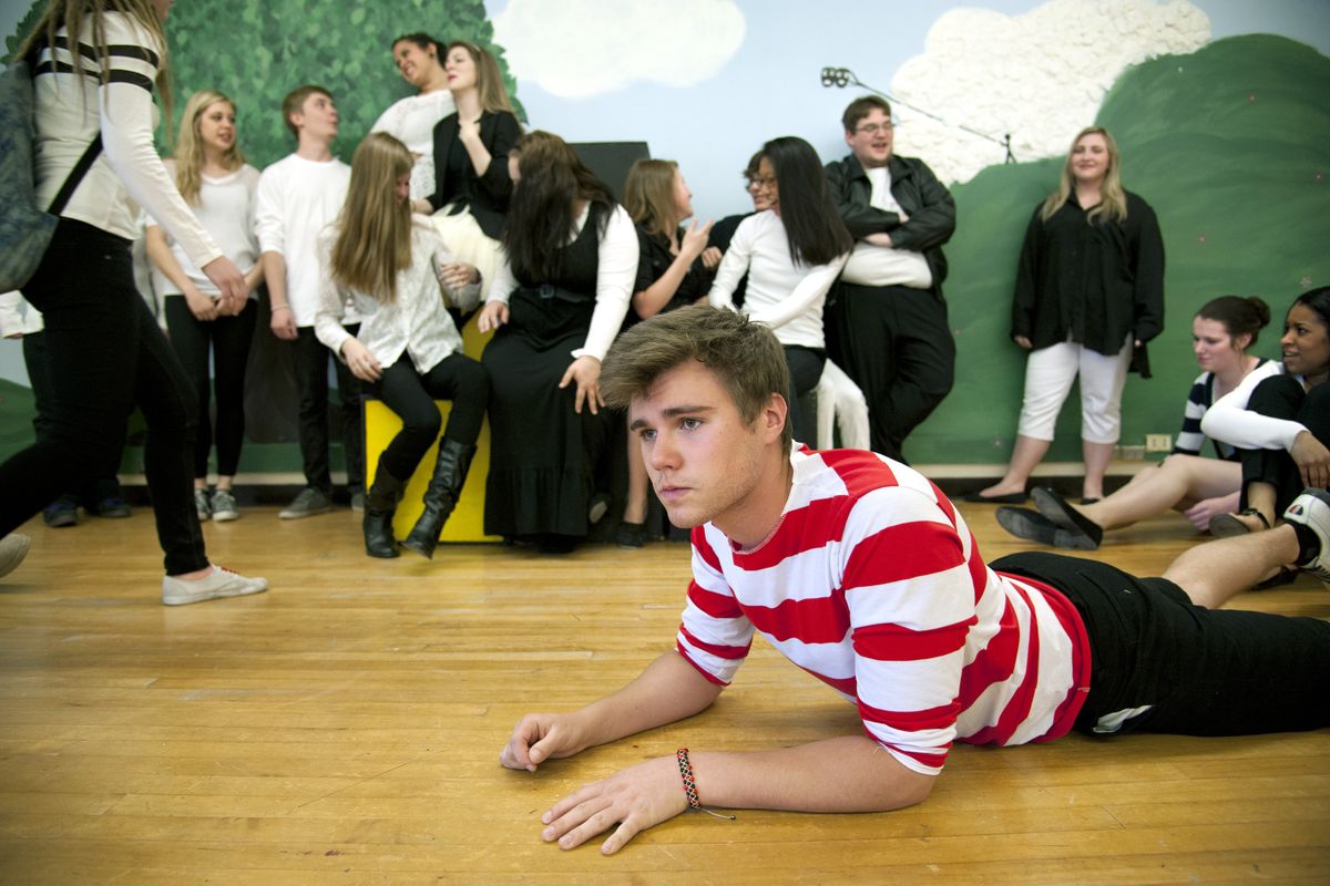 Sergey Grankin, as Achilles, and cast members rehearse a play Friday at Ferris High School as part of “Project Hope: Stop Bullying.” (Dan Pelle)