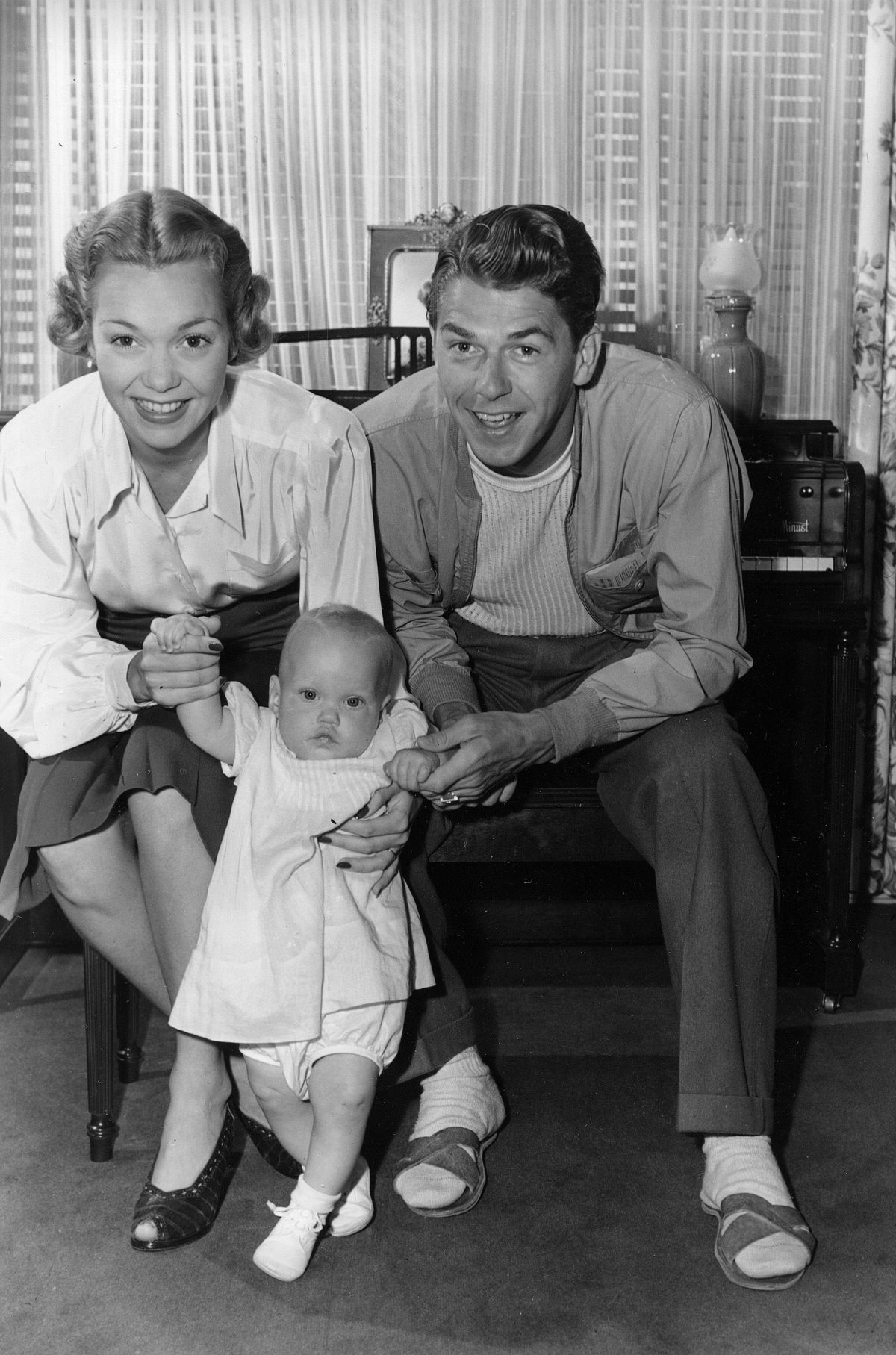 ** FILE ** Actors Jane Wyman and Ronald Reagan hold their nine-month-old daughter Maureen Elizabeth, on Sept. 13, 1941, at their home in Hollywood, Calif. (File / Associated Press)
