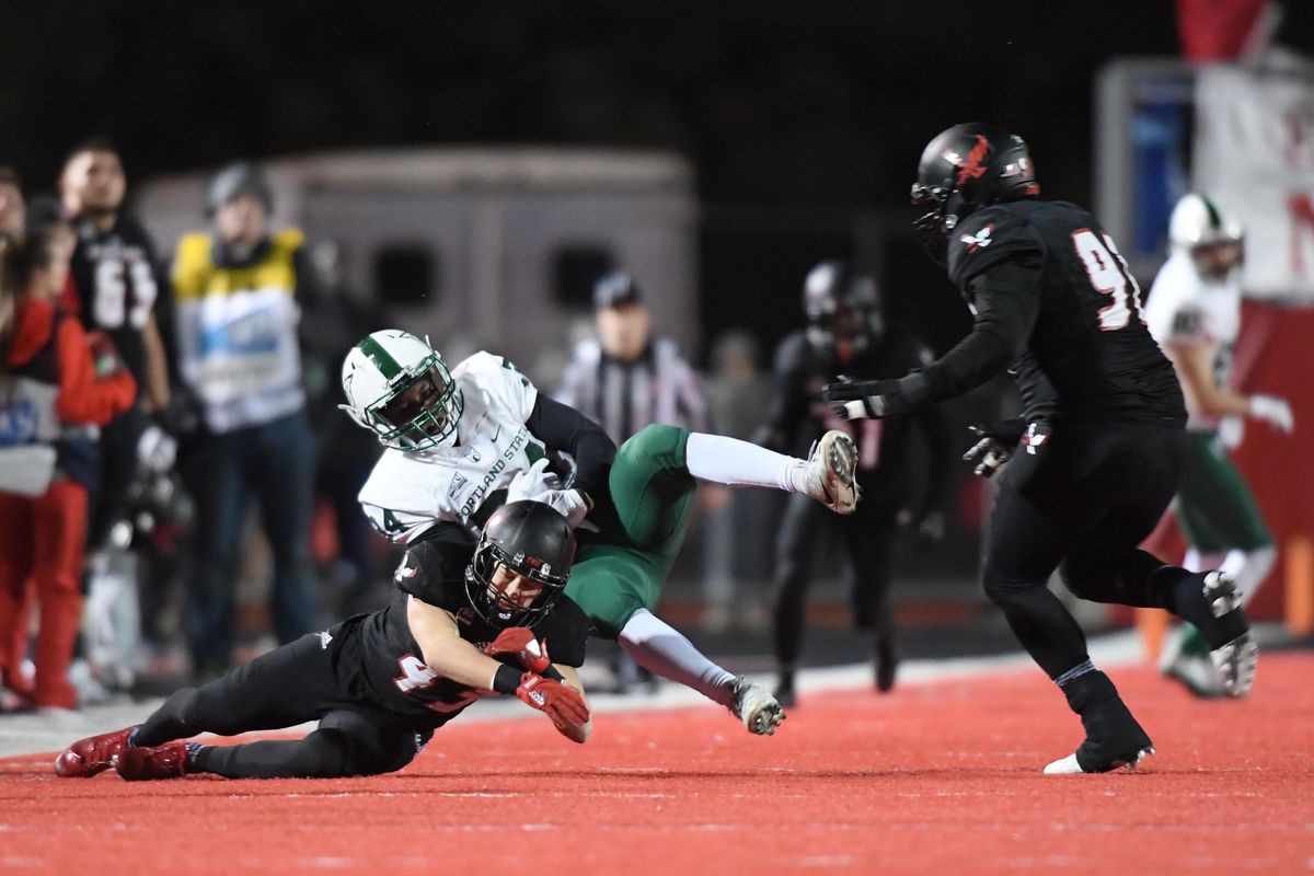 Eastern Washington  defensive back Calin Criner  collides with Portland State  running back Chase Morrison  during the second half  Nov. 18, 2017, at Roos Field in Cheney. EWU won  59-33. (Tyler Tjomsland / The Spokesman-Review)