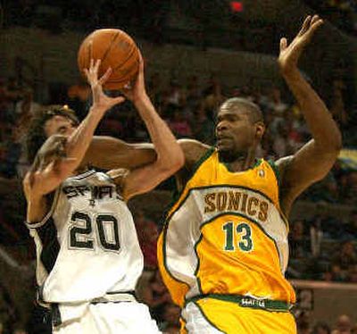 
Sonics' Jerome James, right, fouls Spurs' Manu Ginobili. 
 (Associated Press / The Spokesman-Review)