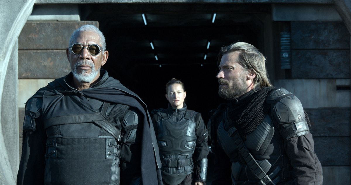 Beech (Morgan Freeman, left) gives orders to Kara (Zoe Bell, center) and Sykes (Nikolaj Koster-Waldau) in “Oblivion.”