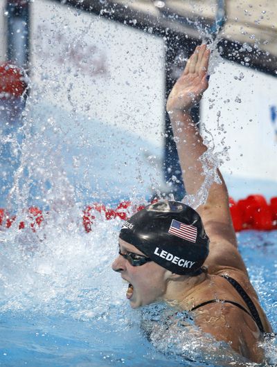American gold medal winner Katie Ledecky celebrates record. (Associated Press)