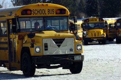 
A driver steers a school bus out of the bus yard at Deer Park School District's transportation department in Deer Park.
 (Holly Pickett / The Spokesman-Review)