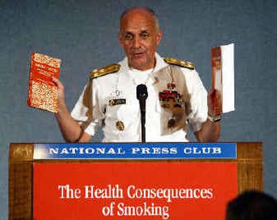 
Surgeon General Richard Carmona holds up the 28th surgeon general's report, along with the much smaller first report, on the health consequences of smoking. Surgeon General Richard Carmona holds up the 28th surgeon general's report, along with the much smaller first report, on the health consequences of smoking. 
 (Associated PressAssociated Press / The Spokesman-Review)