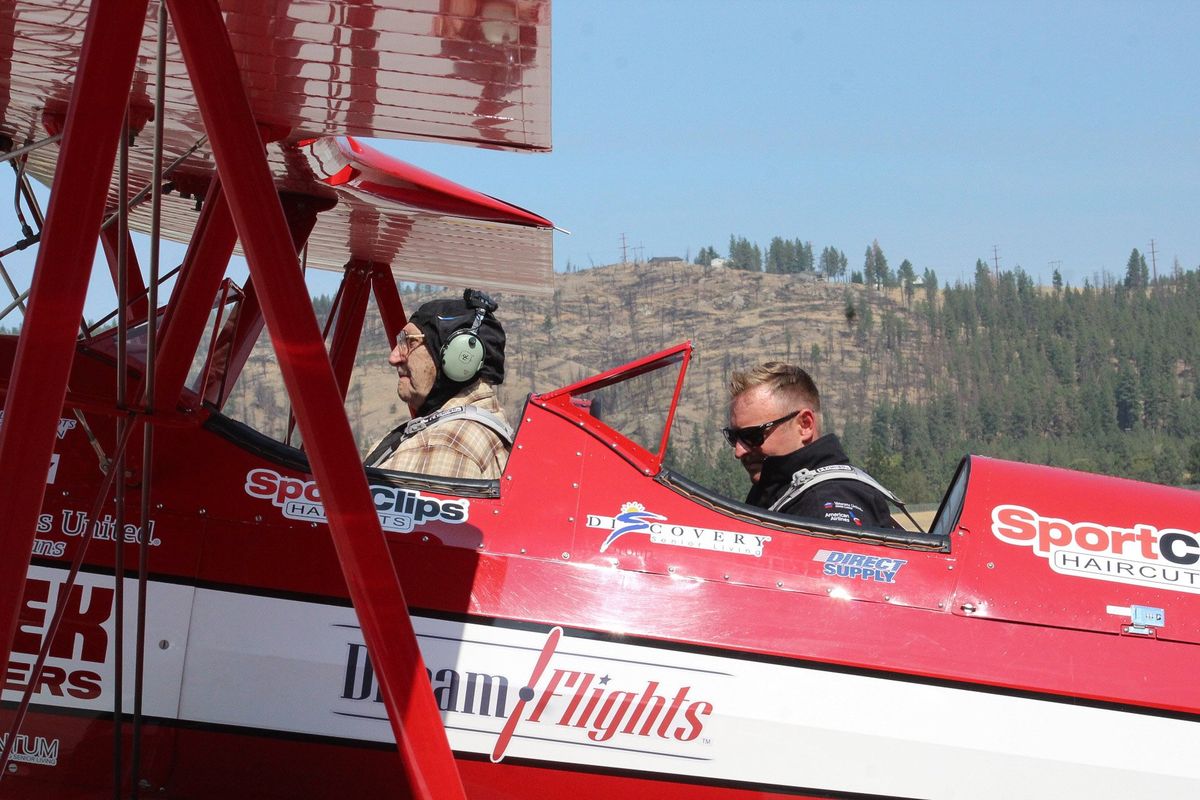 Leonard Paulsen and Clint Cawley, a “Dream Flight” pilot, prepare for takeoff at Felt’s Field, Aug. 24, 2021.  (Jordan Tolley-Turner/The Spokesman-Review)