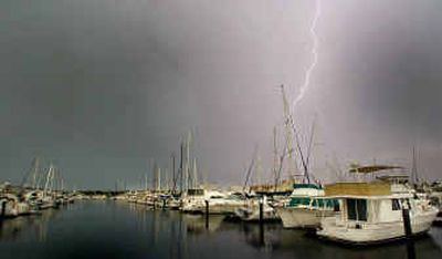 
Lightning strikes over the Halifax Harbor Marina during a late afternoon thunderstorm Wednesday in Daytona Beach, Fla. Storms are expected to continue through the weekend as Tropical Storm Bonnie and Hurricane Charley approach Florida. Gov. Jeb Bush has declared a state of emergency for all of Florida.
 (Associated Press / The Spokesman-Review)