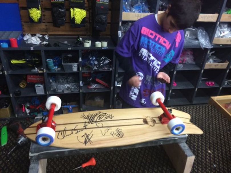 A skateboard signed by the Red Hot Chili Peppers is being auctioned in December 2013 to benefit the Ferry County Rail Trail. (courtesy)