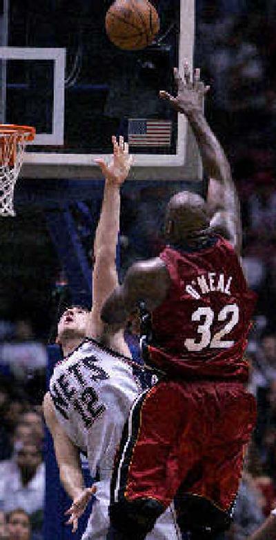 
Miami center Shaquille O'Neal shoots over New Jersey's Nenad Krstic during the fourth quarter. 
 (Associated Press / The Spokesman-Review)