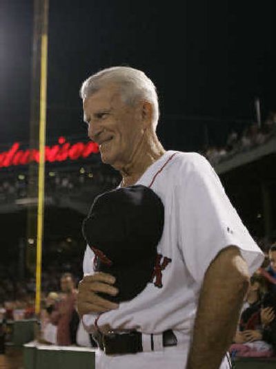 
Boston great Johnny Pesky smiles as he stands near Pesky's Pole, the foul pole down the right-field line at Fenway Park.
 (Associated Press / The Spokesman-Review)