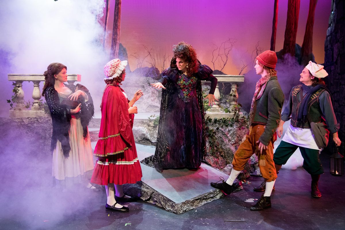 Andrea Olsen, center, playing the part of the Witch, center, acts out a scene from the Spokane Valley Summer Theatre’s musical, “Into the Woods” with, from left: Callie McKinney Cabe, playing the Baker’s Wife; Noelle Fries, playing Little Red Ridinghood; Kyle Adams, playing Jack; and Michael J. Muzatko at Central Valley High School in Spokane Valley. (Tyler Tjomsland / The Spokesman-Review)