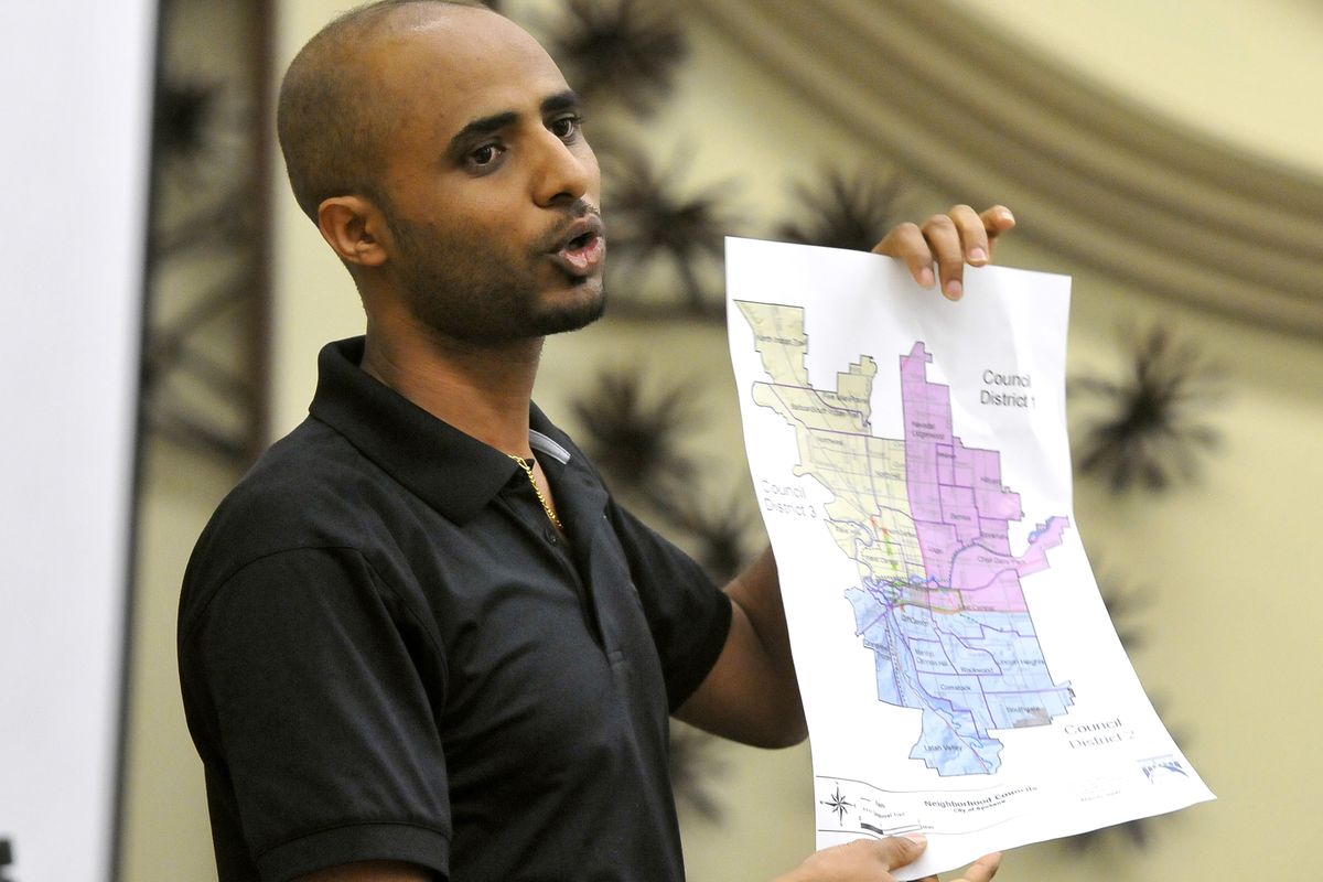 Daniel Ghebreab shows a map of the alcohol impact area that he says is unfairly harming his business. (Jesse Tinsley)