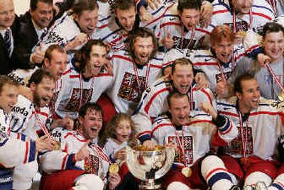 
Czech Republic players celebrate a victory over Canada in the world hockey championship final on Sunday.
 (Associated Press / The Spokesman-Review)
