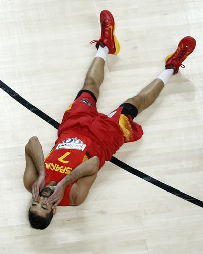 Spain’s Juan Carlos Navarro sprawls on the court Wednesday after France pulled a quarterfinal upset at the Basketball World Cup. (Associated Press)