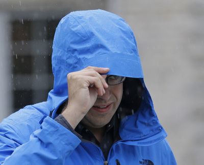 Subway restaurant spokesman Jared Fogle walks to a waiting car as he leaves his home Tuesday in Zionsville, Ind. (Associated Press)