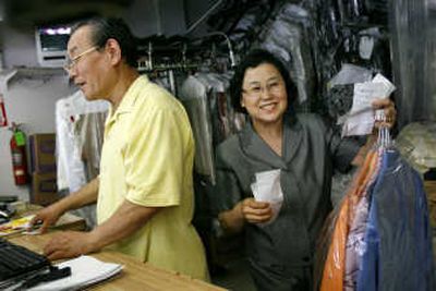 
Jin Nam Chung and his wife, Soo Chung, work Monday at their business.Associated Press
 (Associated Press / The Spokesman-Review)