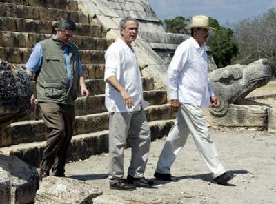 
Canadian Prime Minister Stephen Harper, left, President Bush and Mexican President Vicente Fox, right, tour Mayan ruins in Chichen Itza, Mexico, on Thursday, during their North American summit.  
 (Associated Press / The Spokesman-Review)
