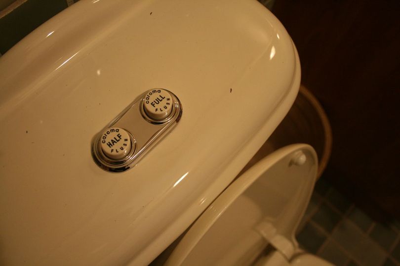 The toilets in the home have two flushing options, depending on how much water is needed. There's also a waterless urinal. (Megan Cooley)