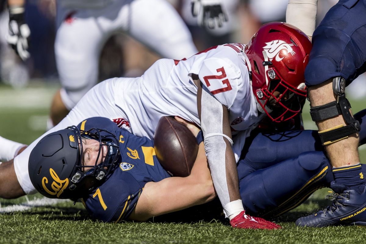 Washington State defensive end Willie Taylor III sacks California quarterback Chase Garbers during the first quarter of Saturday’s Pac-12 Conference game in Berkeley, Calif. The Cougars finished with four sacks.  (Associated Press)