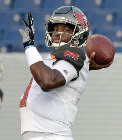 In this Aug. 28, 2018, file photo, Tampa Bay Buccaneers quarterback Jameis Winston warms up before a preseason NFL football game against the Tennessee Titans, in Nashville, Tenn. Winston’s suspension is over. The question is will he return as the No. 1 quarterback of the Tampa Bay Buccaneers, who are off to a 2-1 start with Ryan Fitzpatrick throwing for more than 400 yards in each game. (Mark Zaleski) / Associated Press)