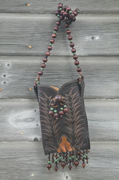 Try creating unique, one-of-a-kind purses from old cowboy boots. You can also try designing jewelry (necklaces from crystal chandeliers), hair accessories (twill tape dyed and wrapped around hair clips) and home decor (old chenille bedspreads turned into shower curtains).  (Maryjane Butters / United Features Syndicate)