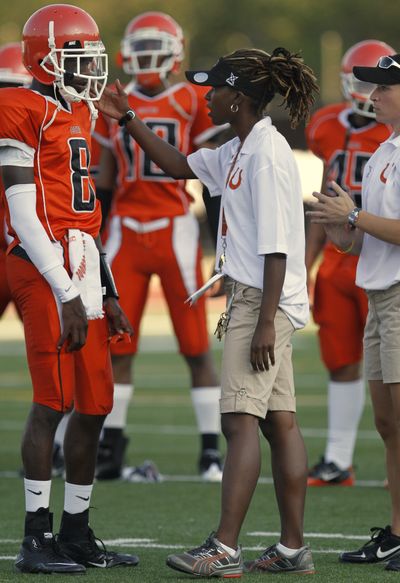 Jayme Hutchins, left, receives directions from Coolidge High coach Natalie Randolph. (Associated Press)