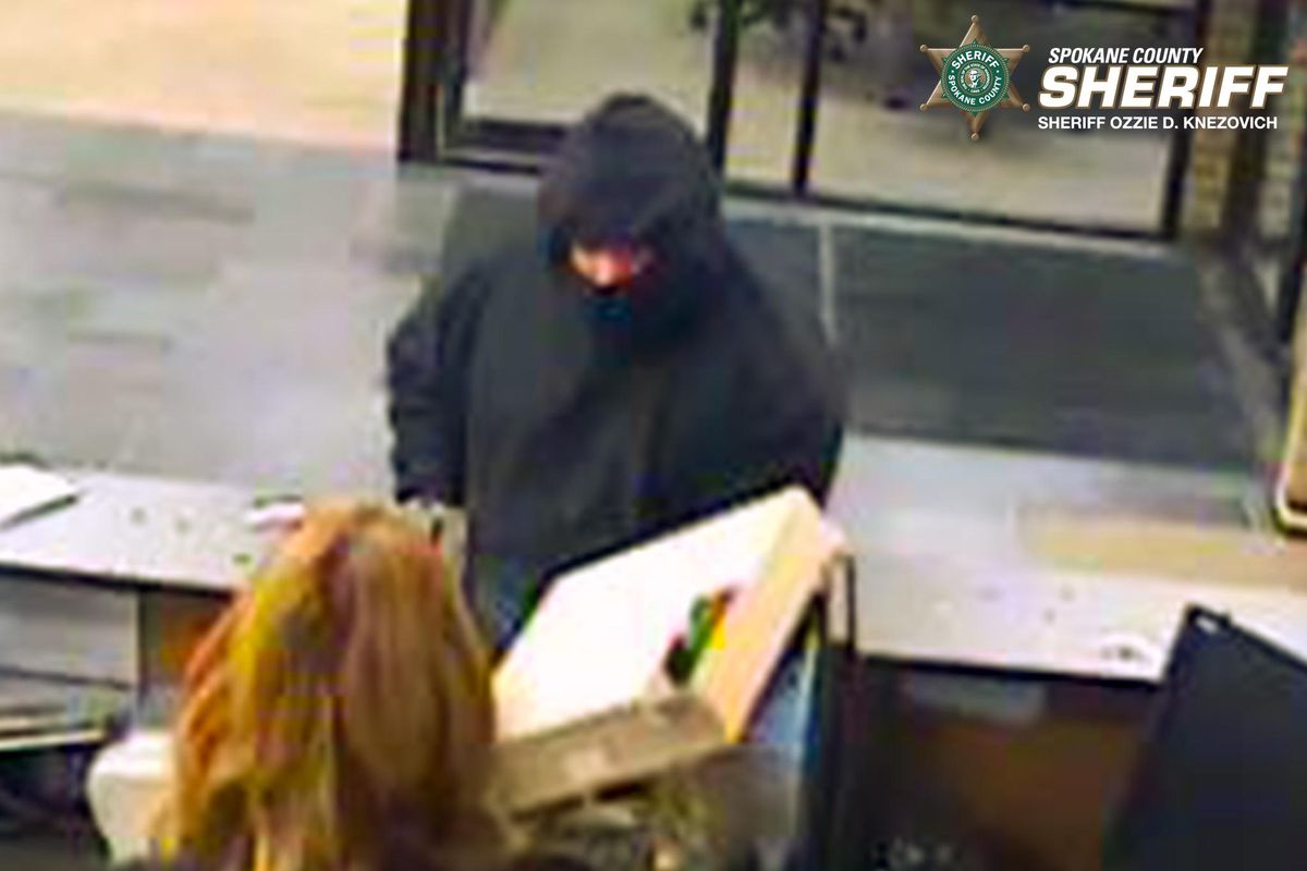 Surveillance photo of bank robbery at the Umpqua Bank branch located in 200 block of N. Felts in Spokane Valley. Authorities have arrested 51-year-old Michael J. Yardley and charged him with 2 counts of Robbery 1st Degree for two robberies at the same branch in July and October. (Spokane County Sheriff’s Office)
