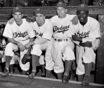 Brooklyn Dodgers players, from left, John Jorgensen, Pee Wee Reese, Ed Stanky and Jackie Robinson pose at Ebbets Field in New York on April 15, 1947. Robinson played his first major league game, for the Dodgers. He was the first black to appear in the majors since 1884. (Associated Press)