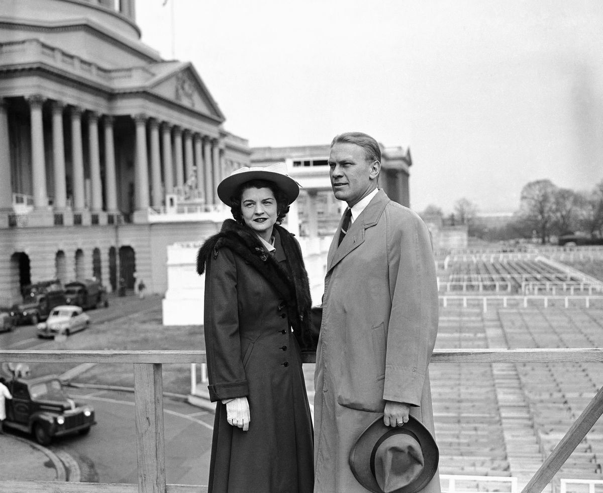 FILE - In this Jan. 4, 1949 file picture, Rep. Gerald R. Ford, Jr. of the Fifth Michigan District, and his wife Betty Ford stand on the inaugural stands in Lansing, Mich. On Friday, July 8, 2011, a family friend said that Betty Ford had died at the age of 93. (Associated Press)