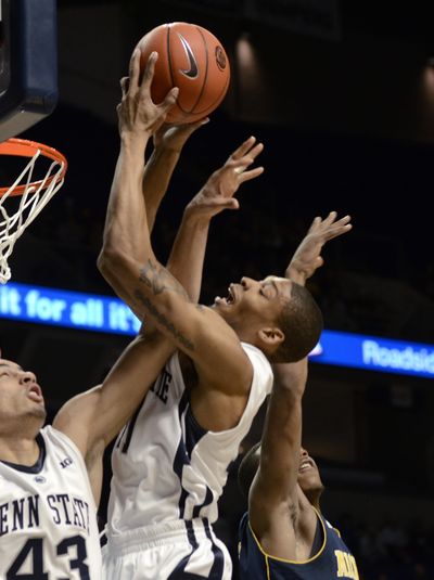 Jermaine Marshall, center, had 19 of his 25 points in second half. (Associated Press)