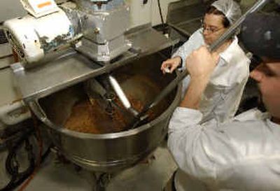 
Rutgers University food technicians, Doug Balster, right, and Elizabeth Purcelly mix up a batch of soup for the new Soup Man company. 
 (Associated Press / The Spokesman-Review)