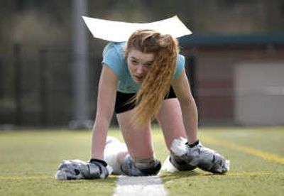 
Laura D'Asaro, 17, trains for her attempt to break a Guinness World Record for the fastest time to crawl a mile in Seattle  on Wednesday.  Seattle Times
 (John Lok Seattle Times / The Spokesman-Review)