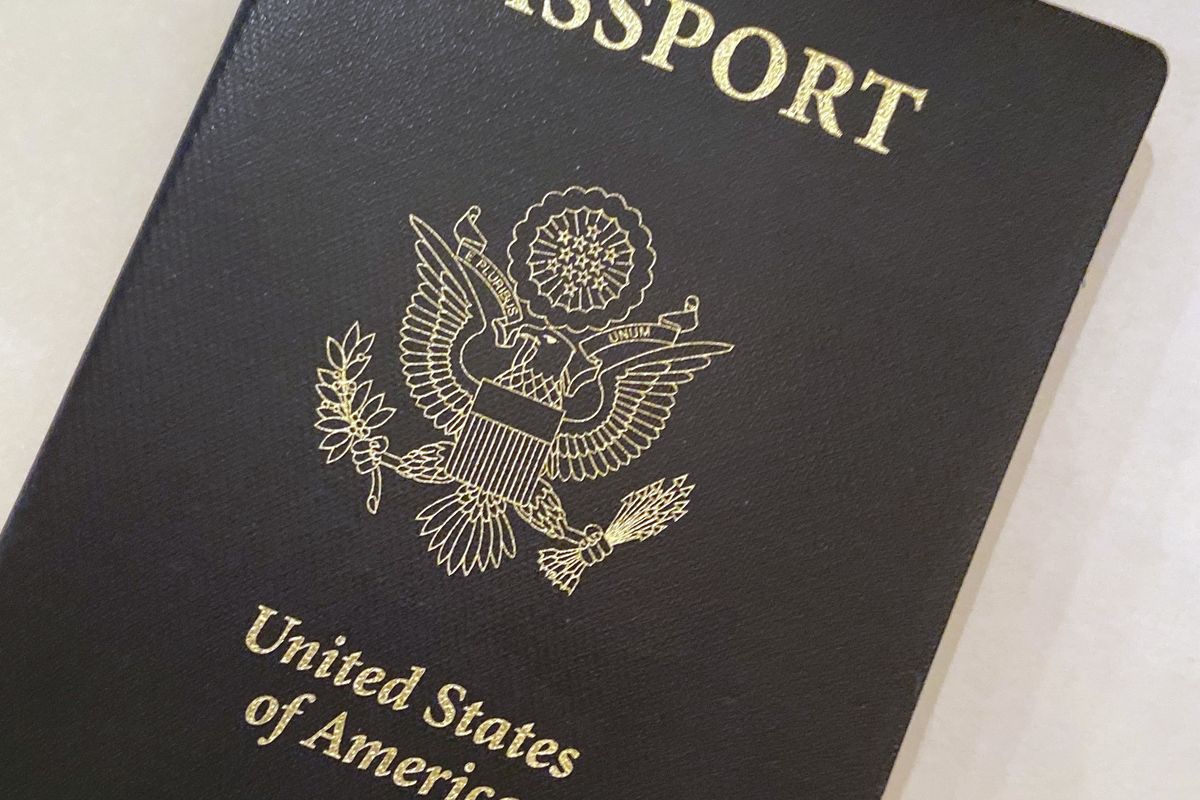 FILE - This May 25, 2021 file photo shows a U.S. Passport cover in Washington. The United States has issued its first passport with an “X” gender designation, a milestone in the recognition of the rights of people who don