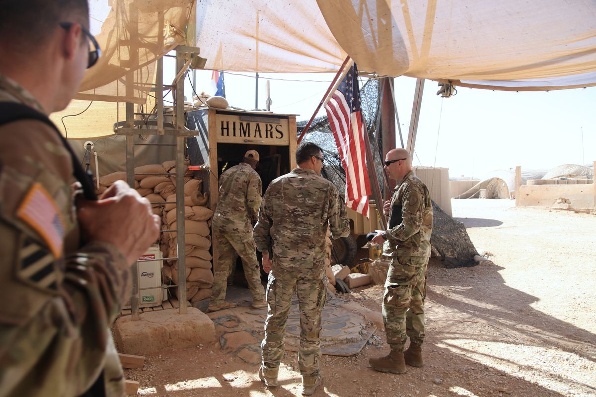 U.S. military officials enter a high-mobility artillery rocket system facility at the al-Tanf garrison in Syria on June 21. MUST CREDIT: Washington Post photo by Karoun Demirjian  (Karoun Demirjian/The Washington Post)