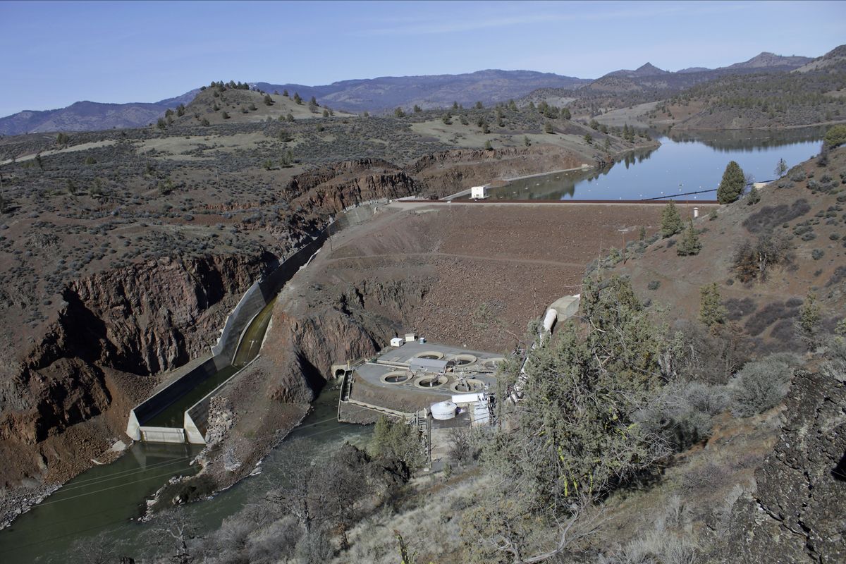 FILE - In this March 3, 2020, file photo, is the Iron Gate Dam, powerhouse and spillway are on the lower Klamath River near Hornbrook, Calif. A new agreement announced Tuesday, Nov. 17, 2020, promises to revive faltering plans to demolish four massive hydroelectric dams on a river along the Oregon-California border to save imperiled salmon by emptying giant reservoirs and reopening hundreds of miles of potential fish habitat that