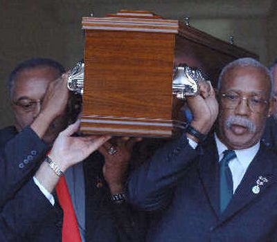
Tommie Smith, left, and John Carlos, act as pallbearers at Peter Norman's funeral.
 (Associated Press / The Spokesman-Review)
