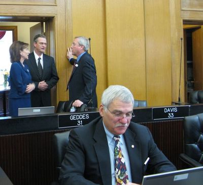 Sen. John Goedde, R-Coeur d'Alene, works at his computer in the Senate chamber while other senators talk, during one of the many breaks in the action at the Legislature on Thursday. (Betsy Russell / The Spokesman-Review)