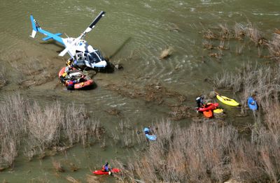 A rafter is loaded onto a helicopter Sunday on the Murtaugh Canyon stretch of the Snake River. The accident claimed the life of Dirk Gombert, of Idaho Falls. The other three members of the rafting party were not injured.  (Associated Press / The Spokesman-Review)